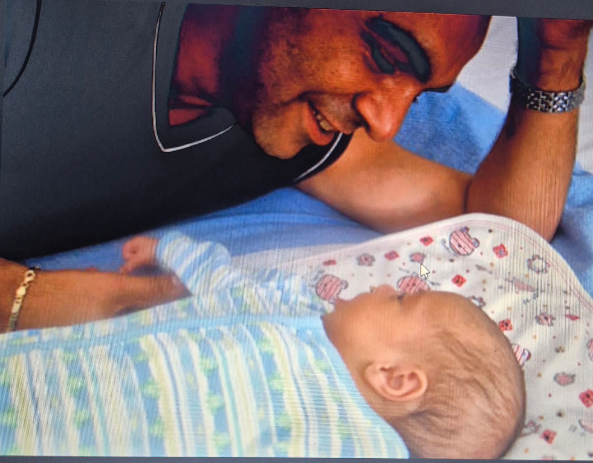 Dad, meeting the light of his life. Est. 2003.